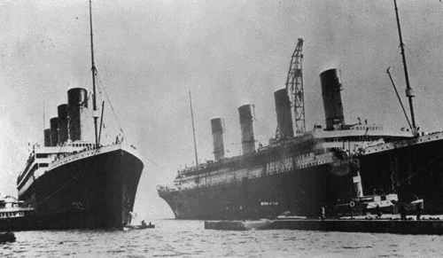 RMS Olympic entering the Thompson graving dock for repairs while Titanic is under construction. The over-hanging starboard bridge-wing can be seen in the photograph. Photo from author's collection.